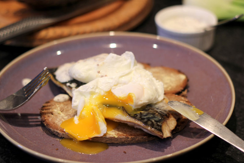 mackerel on rye bread with poached eggs and mustard yoghurt sauce