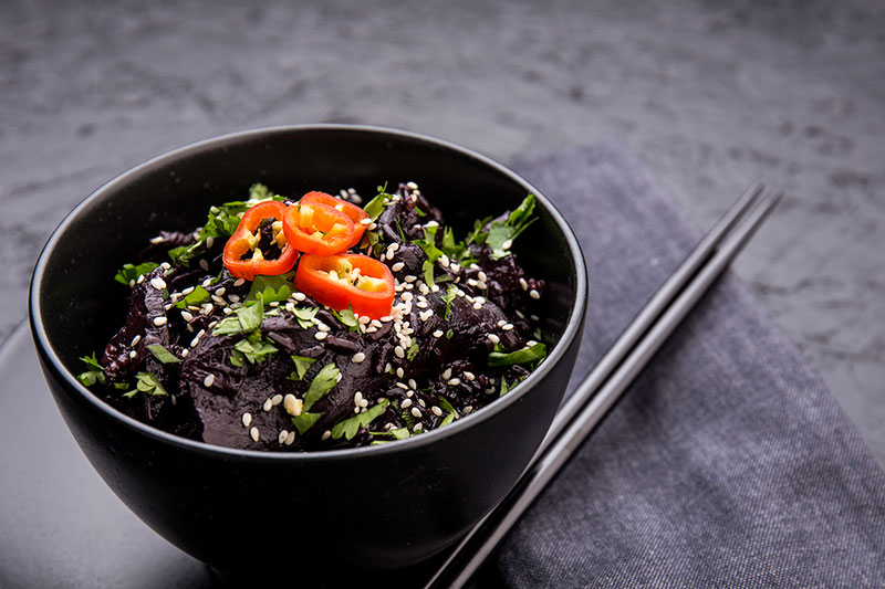 Black rice and wild mushrooms are the star of this one pot cooked on a base of onion, garlic & ginger, mixed with miso paste, mirin and vegetable stock then garnished with chilli, sesame seeds and coriander. It's a dark, rich and mysterious vegetarian and vegan one pot!