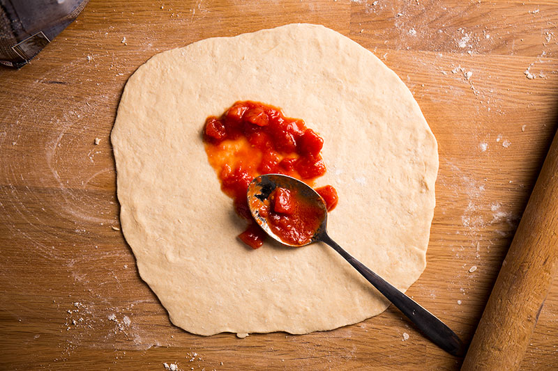 How to make authentic pizza sauce with just three ingredients, the best tomatoes you can get, ideally San Marzano, plus garlic and extra virgin olive oil all lightly infused together make the best genuine italian pizza sauce for your homemade pizzas.