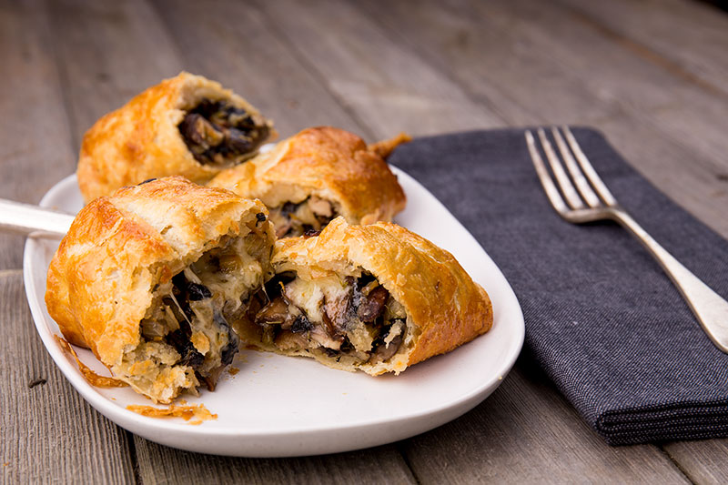 Golden, light and flaky vegetarian sausage rolls made with spelt rough puff pastry and filled with onion, garlic, mushrooms, thyme and oozing, molten Comté cheese. Perfect for the dinner table or the picnic basket.
