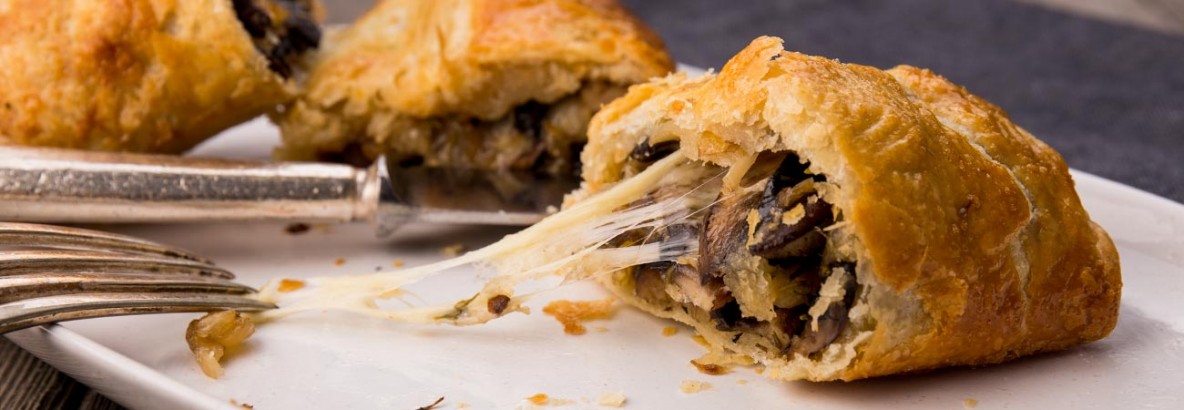 Golden, light and flaky vegetarian sausage rolls made with spelt rough puff pastry and filled with onion, garlic, mushrooms, thyme and oozing, molten Comté cheese. Perfect for the dinner table or the picnic basket.