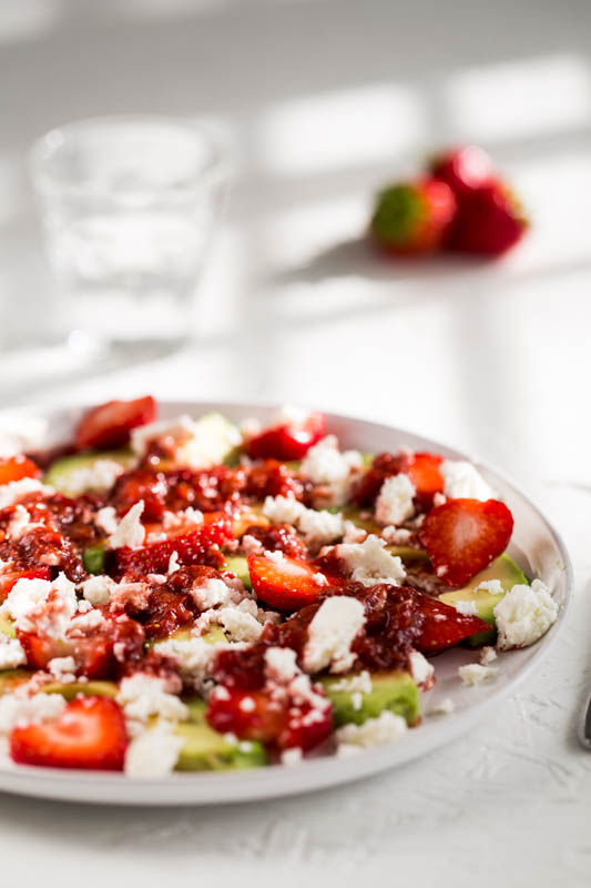 Sweet summery strawberries play against the tangy, metallic feta and the creamy avocado to make a delicious salad that’s ripe for any summer picnic or lunch table. Dressed with a rich strawberry and balsamic dressing, this vegetarian strawberry avocado salad is a beautifully fresh, easy to make dish that’s a perfect starter, side dish or salad.