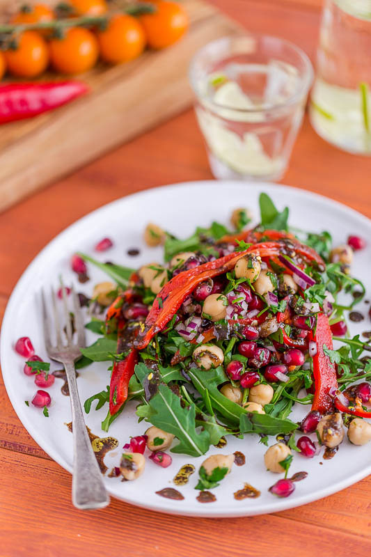 Sweet, crunchy pomegranate seeds sit alongside the sweet, sharp pomegranate molasses in this light chickpea and red pepper salad which makes a great side dish, accompaniment to bread & cheese or alongside a bigger meal or picnic. It really is simple, with no cooking and just a few ingredients, most of which can be kept in the cupboard to whip together at the last second. It's vegetarian and vegan as well, so perfect or everyone!