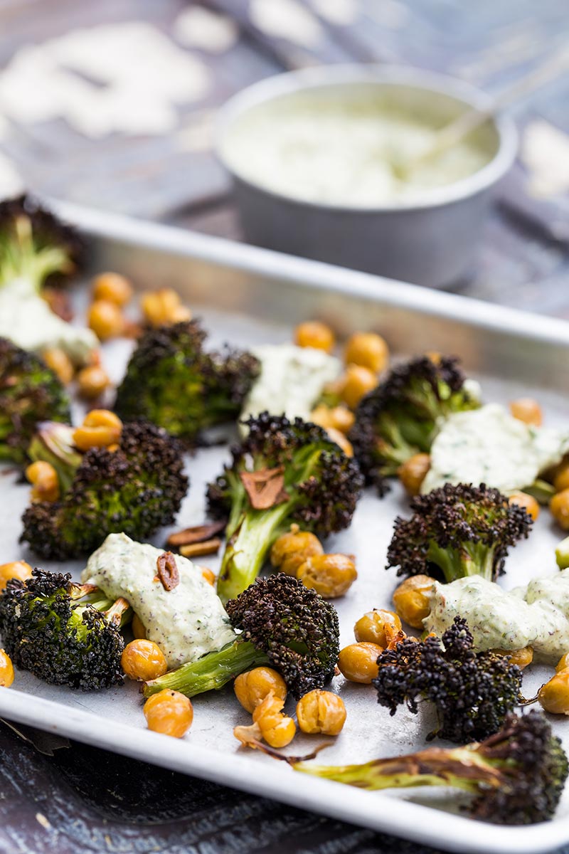 Roasted broccoli is a revelation! It’s a great way to cook this green, adding a welcome texture which can easily be ruined by boiling. Coated with garlic and olive oil, along with slightly crisped and browned edges, it brings a completely different flavour to this Brassica. Throwing in some chickpeas and a herb yoghurt rounds it off beautifully, making a truly engrossing vegetarian side dish to bring to the table.